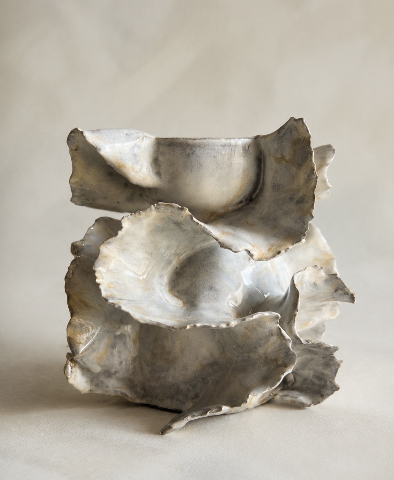 Ivory handbuilt sculptural vessel with layered organic folds